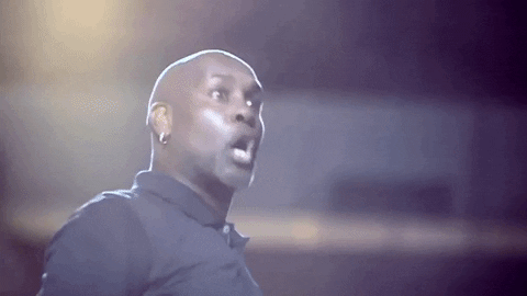 Celebrity gif. Gary Payton spins his head around with wide eyes as if in shock.