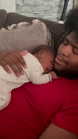 Newborn Baby Shocks Father With Surprise Kiss