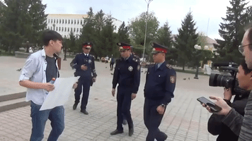 Kazakhstani YouTuber Holding Blank Sign Detained in Freedom-of-Speech Experiment