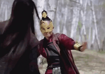 Movie gif. Shu Qi as Nie Yinniang in The Assassin fights a masked assailant in the forest.