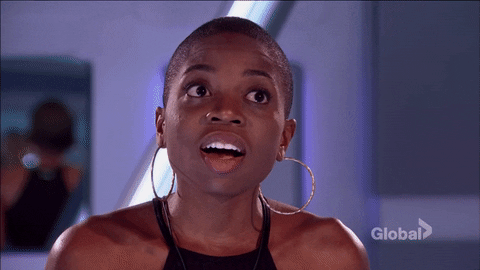 Reality TV gif. Contestant on Big Brother gasps with shock and puts her hands up to her head.