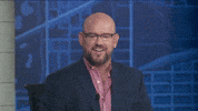 TV gif. TV news anchor raises his glasses up to his forehead, then tilts them sideways on his face, then puts them back on normally.