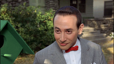 GIF of Pee Wee Herman with his hand up to his ear saying, "Shhh, I'm listening to reason."