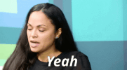 Video gif. Woman turns her head slowly while blinking and then looks over to someone to say, “Yeah.”
