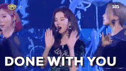 Video gif. Members of K-pop group Girls Generation dance in unison on stage, waving their arms. Text, “Done with you.”