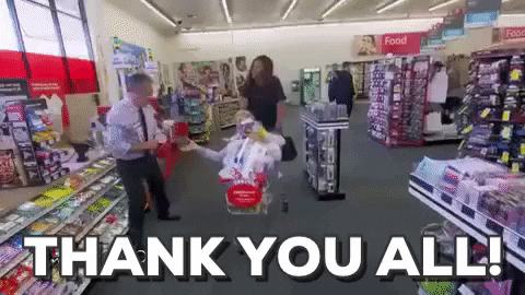 Celebrity gif. Michelle Obama pushes Ellen Degeneres in a shopping cart full of items at CVS. Text, “Thank you all!”