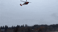 Coast Guard Airlifts Motorist Stuck Atop Vehicle Amid Record Flooding in Washington