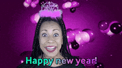 Video gif. A woman with a pink tiara grins at us merrily, shrugging her shoulders for emphasis as pink balloons fly behind her. Text, "Happy new year!"