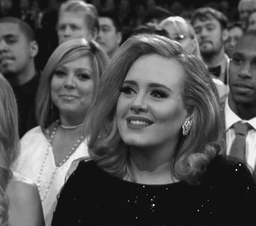 Celebrity gif. Seated among an audience, Adele smiles and nods agreeably.