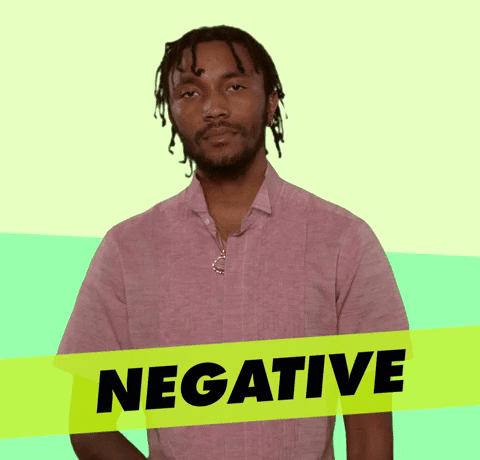 Video gif. A man hand signals no by using his hand to draw a line at his neck and he says, "Negative."