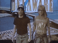 waynes world shrug GIF