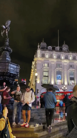 Tribute to Queen Elizabeth II Draws Large Crowds at Piccadilly Circus