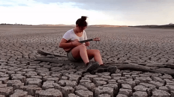 Young Woman Sings Drought Song in Bone-Dry Rural Queensland Dam