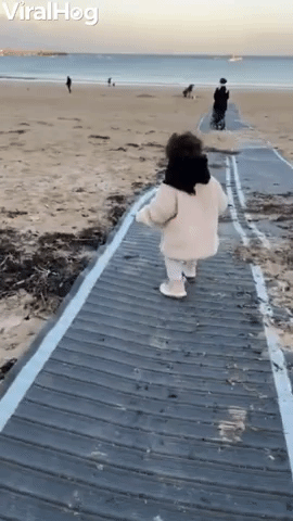 Kid Running to Sea Takes Early Dip