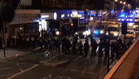 Riot Police Charge Down Kingsland Road During Rashan Charles Protest