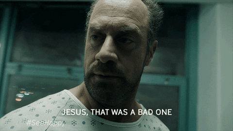 TV gif. Christopher Meloni as Nick in Happy looks disoriented as he blinks and mutters, "Jesus, that was a bad one."