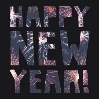 Text gif. Text rotates around and changes from gold to having images of fireworks in the sky. Text, “Happy New Year!”
