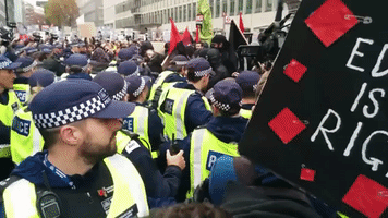 Police and Demonstrators Clash Outside Government Building Amid Student Protest