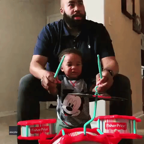 Toddler Can't Stop Laughing as He Plays Drums With Dad