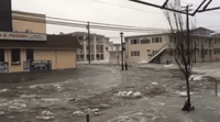 Sea Water Washes Through Main Street of New Jersey Coastal Town