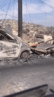 Scorched Vehicles Line Street in Fire-Struck Vina Del Mar