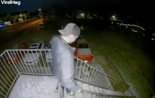 Guy Slips and Slides Down Icy Stairs