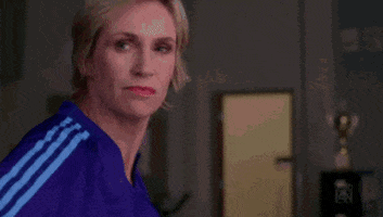 TV gif. Jane Lynch as Sue on Glee very seriously says to the camera, “outstanding.”