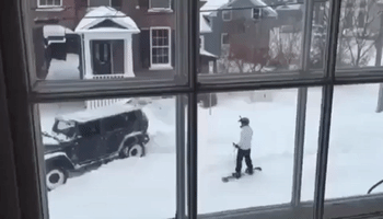 Brave Snowboarder Gets Towed by Jeep