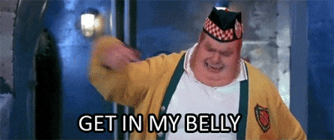 Movie gif. Mike Myers as Fat Bastard in Austin Powers. He looks upset as he points urgently at his stomach and yells, "Get in my belly!" 