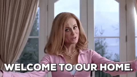 Movie gif. Amy Poehler as Mrs. George in "Mean Girls" holds her arms out and walks towards us for a hug; our gaze focuses on her chest.