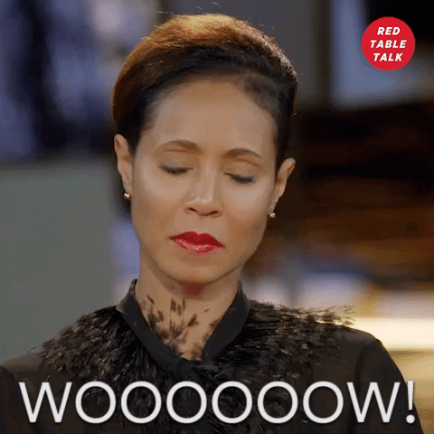 Celebrity gif. Jada Pinkett Smith glances up surprised as she mouths the word that appears. Text, "Wow"