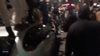 Crowd Shouts and Jumps on Vehicles Outside Dolce & Gabbana Store in SoHo