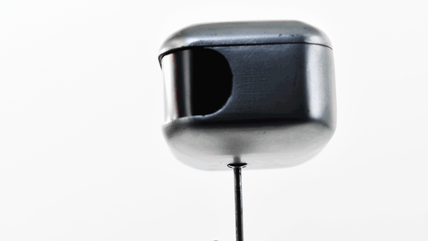 Video gif. Robot head turns to us and narrows its digital eyes in suspicion.