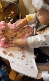 Baby Girl Enjoys Cake on First Birthday 