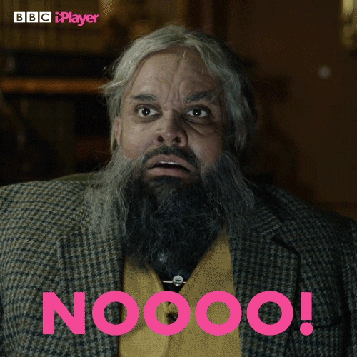 Video gif. We zoom in on a terrified man’s face as he screams, eyes wide, “NOOOO!”