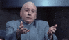 Movie gif. Mike Myers as Dr. Evil in Austin Powers holds his arms out and beckons for someone to embrace himself. He has a pleading, earnest expression on his face. 