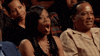 TV gif. A woman seated in an audience drops her jaw and throws her hands up in shocked surprise. 