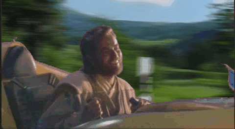 Star Wars gif. Anakin Skywalker, bobbing around happily, pilots a mini spaceship through a beautiful landscape, passing various Star Wars characters as he goes.