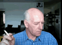 Serious Smoking Man GIF
