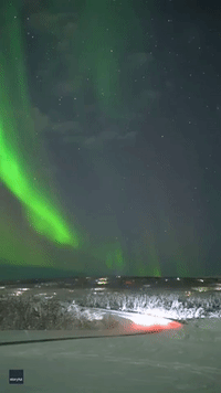 Aurora Chaser Delighted, as Bright Beam Stretches Across Alaskan Sky