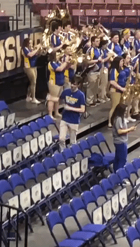 Fan Dances His Heart Out at College Basketball Tournament