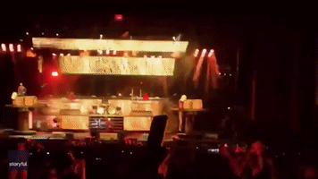 Mosh Pit Forms Around Fire at Slipknot Concert