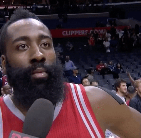 Sports gif. NBA Player James Harden is being interviewed after a game. The interviewer holds a mic to his face and obviously offends him. Harden then rolls his eyes intensely at the person, and swiftly whips his body away like he’s being pulled away to leave the conversation. 
