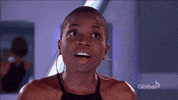 Reality TV gif. Contestant on Big Brother gasps with shock and puts her hands up to her head.