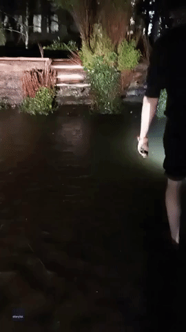 Angler Rescues Fish From Flooded Car Park Before Releasing It Into Nearby River