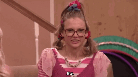 Tonight Show gif. Taylor Swift dresses as a geeky middle schooler with three ponytails that almost look like Cindy Lou Who’s hairstyle, awkwardly looks over at someone and says, “Ew.”
