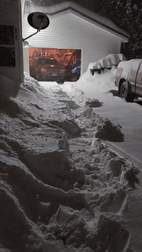 Snow Piles Up on Driveway in Maine After Winter Storm