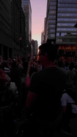 New Yorkers Crowd Manhattan Streets to Catch a Glimpse of 'Manhattanhenge'