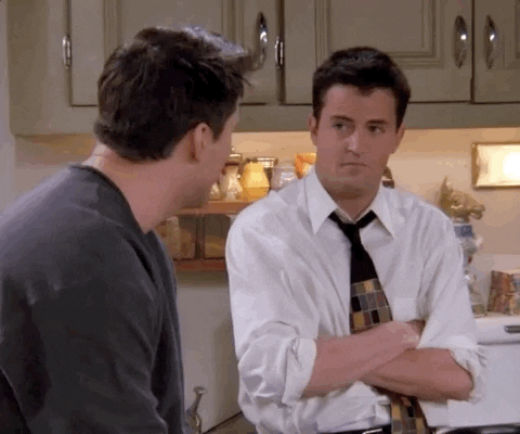 Friends gif. Matthew Perry as Chandler and Matt LeBlanc as Joey erupt with laughter. They bend over as Joey slaps his knee and Chandler clasps his hands together.