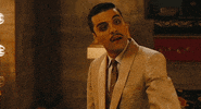 Movie gif. Oscar Isaac as Blue Jones in Sucker Punch tilts his head down and lifts an eyebrow up as he points at someone.